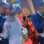Pastor gives groom a heavy knock for ‘over kissing' his bride in church (Video)